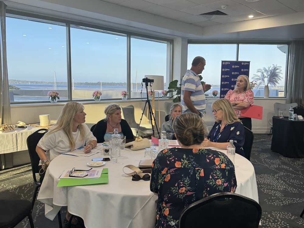 An information night in a room overlooking the water
